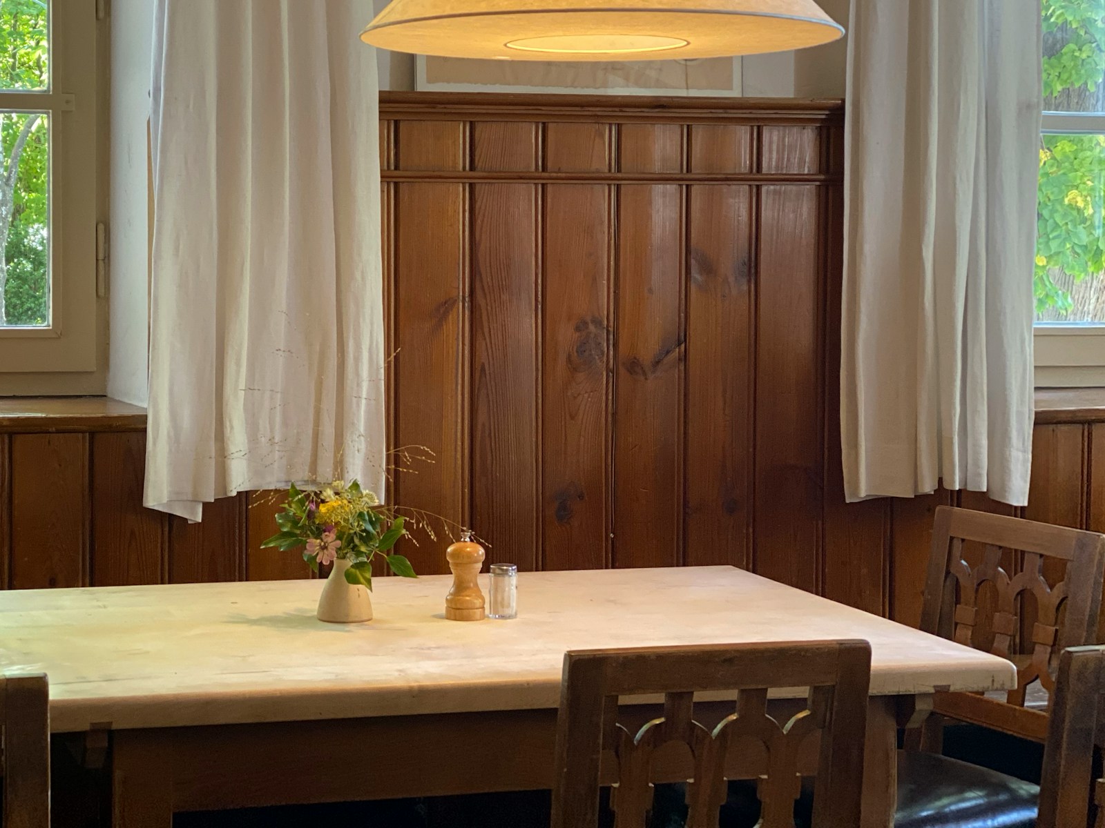 rectangular beige and brown wooden dining table